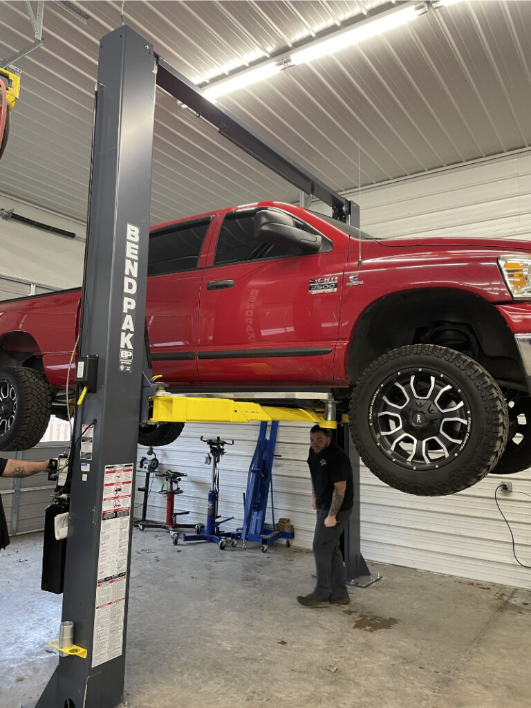 Red Truck being lifted